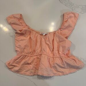 Vintage-inspired pink babydoll blouse